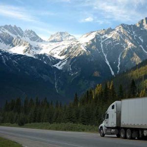 truck driving down mountain road